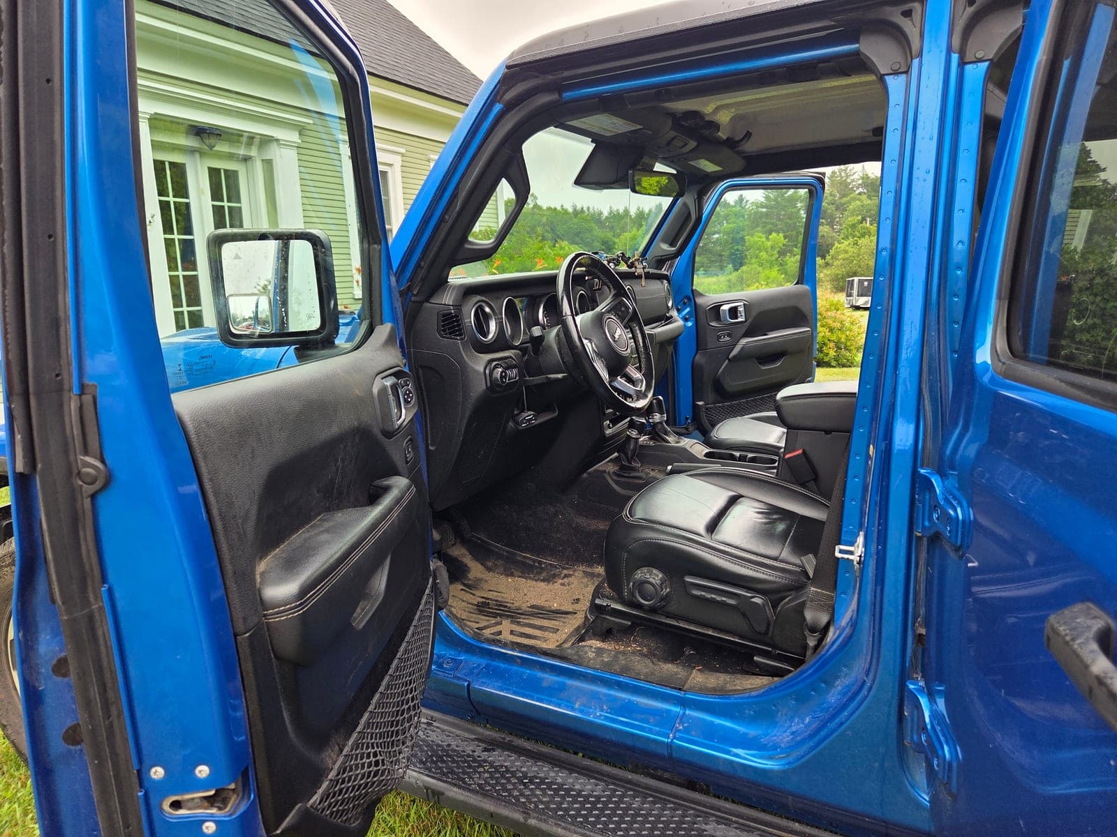 Heavily soiled 2018 Jeep Grand Cherokee interior — before mobile auto detail in Williston, VT